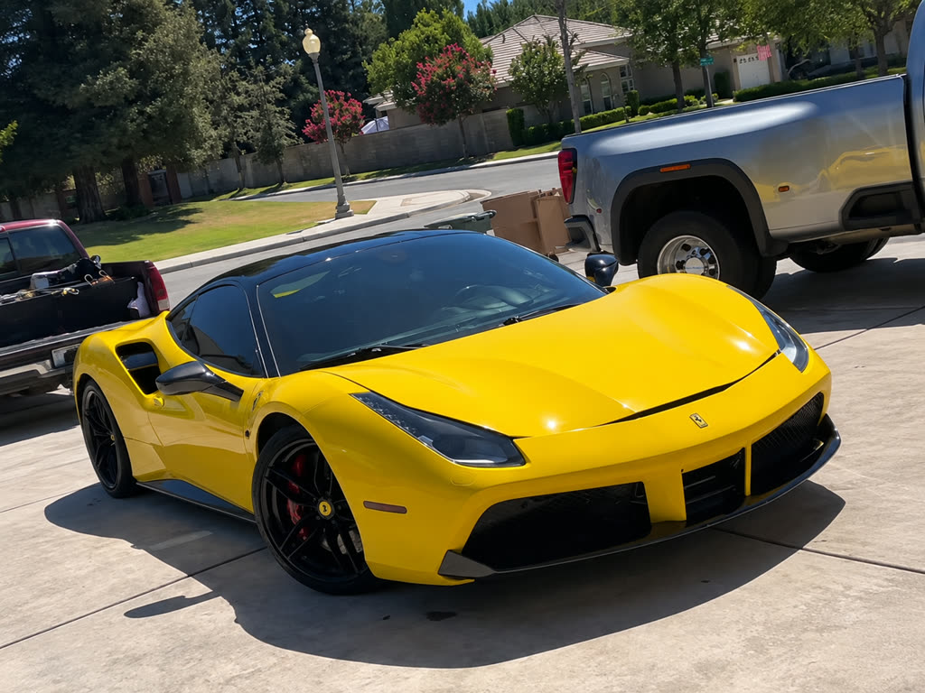 Bright yellow Ferrari with a deep, polished shine after a full detail